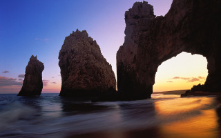 Rocky outcrop sunset beach landscape - a group of rocks free wallpaper