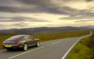 Mountain road sunset car illustration - andrew bell free wallpaper