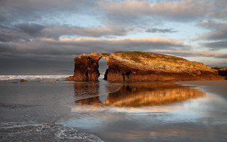 Beach rock formation ocean sunset - widescreen free wallpaper