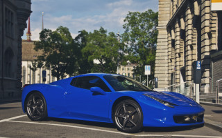 Blue sports car parking lot 2 - a building and trees free wallpaper