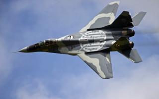 Military jet cloudy sky camouflage - a cloudy blue sky free wallpaper