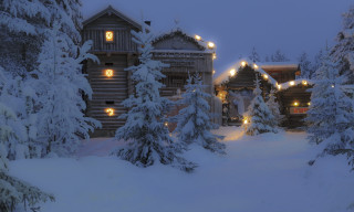 Snowy cabin trees lights night - evgeny lushpin free wallpaper