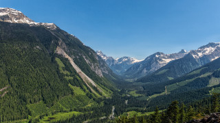 Valley mountain range blue sky - a mountain range in the background free wallpaper
