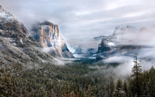 Mountain range forest clouds snowy - a matte painting free wallpaper for desktop