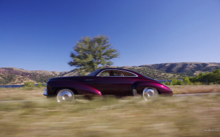 Car mountains forest sky luxury - the background and a tree in the foreground free wallpaper