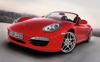 Red sports car mountain road 8 - a mountain range in the background free wallpaper