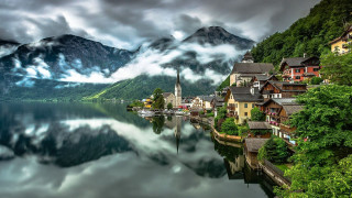 Lake mountains houses cloudy sky - a church free wallpaper