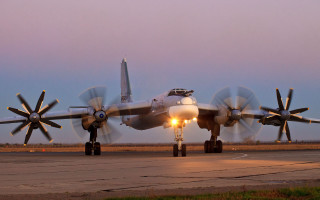 Large propeller plane sunset airport 2 - top of an airport runway free wallpaper