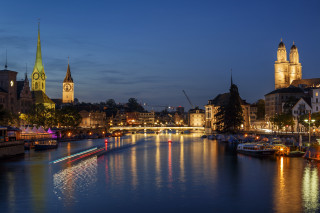 River bridge church night cityscape - the water and a boat in the foreground free wallpaper