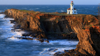 Lighthouse cliff ocean waves sunset 2 - wave free wallpaper
