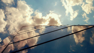Tall building clouds sky reflections - a tall building free wallpaper