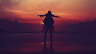 Person beach arms outstretched red - sunset free wallpaper