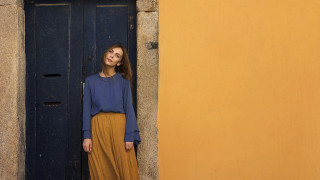 Woman standing door blue shirt - carol bove free wallpaper
