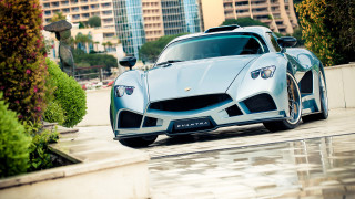 Silver sports car city street 2 - a building and trees free wallpaper