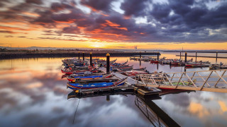 Sunset dock boats clouds cityscape - free ship wallpaper