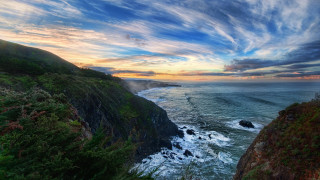 Cliff water sunset clouds forest - expressionism free wallpaper