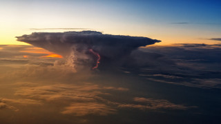 Stormy clouds lightning sunset cityscape - a large cloud free wallpaper