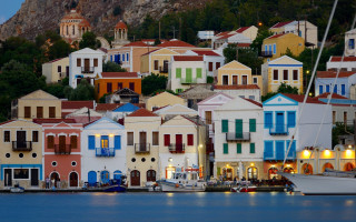 Buildings lake hillside trees bushes - pastell free wallpaper
