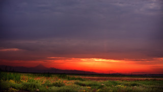 Sunset clouds grass mountains dusk - a sunset free wallpaper