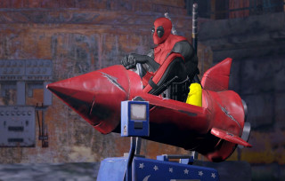 Red suit man riding rocket - a yellow object free wallpaper