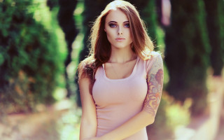 Woman tattoo park blonde blue - tree and bushes behind her free wallpaper