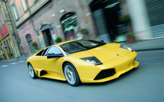 Yellow sports car cityscape rain - a tall building free wallpaper