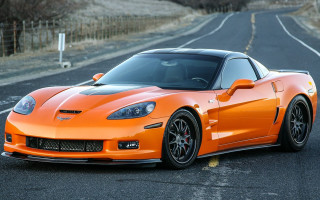 Bright orange sports car parking 10 - the side of the road in a parking lot free wallpaper