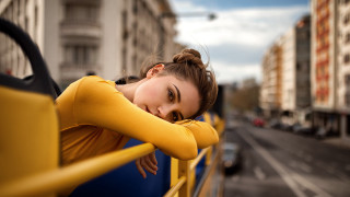 City street woman yellow fence - city background free wallpaper
