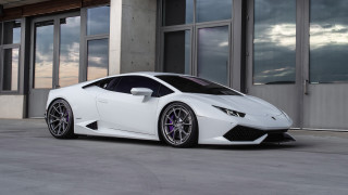White sports car building cloudy - a cloudy sky in the background free wallpaper