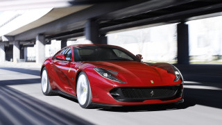 Red sports car driving street 2 - 4k uhd image free wallpaper