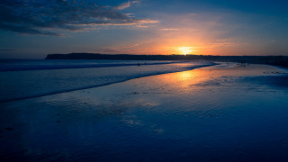 Sunset beach horizon mountains ocean - a sunset free wallpaper