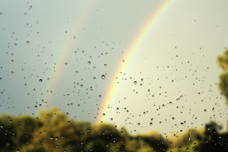 Rainbow through rain drops window - holography free wallpaper