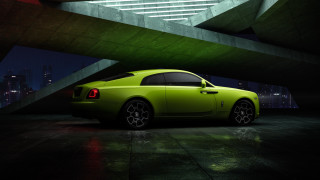Green car parking garage night - a city skyline in the background free wallpaper