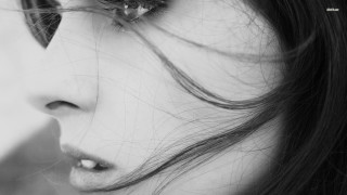 Serious woman long hair flower - long hair and a flower free wallpaper