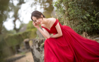 Red dress woman smiling stone - free other wallpaper