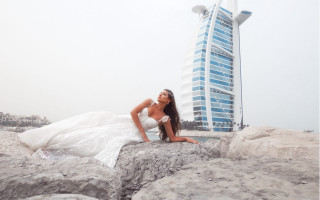 Woman white dress sitting rocks - a white dress free wallpaper