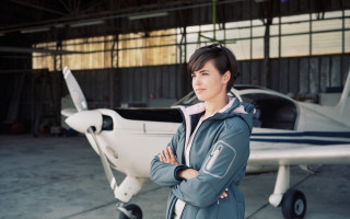 Eve rider woman plane hangar - small free wallpaper