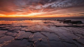Sunset rocky beach cloudy sky 2 - the foreground and a sky free wallpaper