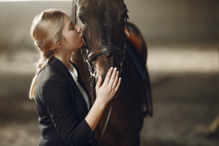 Woman kissing horse stable portrait - her free wallpaper
