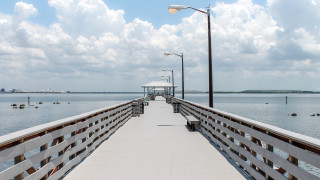 Pier light poles ocean mountain - the end of it free wallpaper