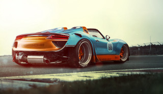 Blue orange sports car driving 2 - a grass free wallpaper