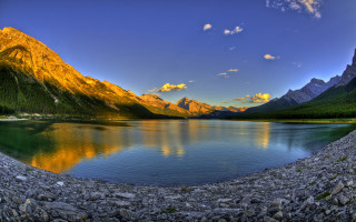 Lake mountains rocks sky sun - under a blue sky free wallpaper