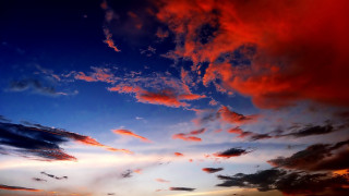 Sunset clouds boat water city 2 - the foreground and a boat in the distance free wallpaper