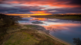 Sunset river island boats cityscape - a sunset over a river free wallpaper