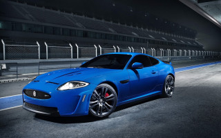 Blue sports car night stadium - a parking lot free wallpaper