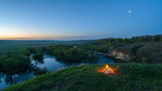 Campfire hill valley river dusk - a crescent moon free wallpaper