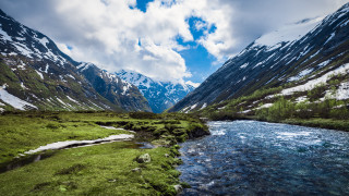Lush green valley stream mountains - a stream free wallpaper
