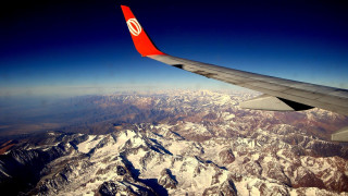 Mountain view red tail sky - a view of a mountain range free wallpaper