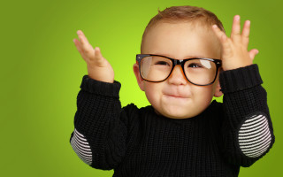 Little boy glasses green background - a black sweater free wallpaper