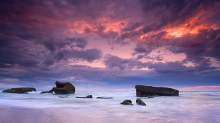 Beach rocks water sunset purple - rich moody colours free wallpaper